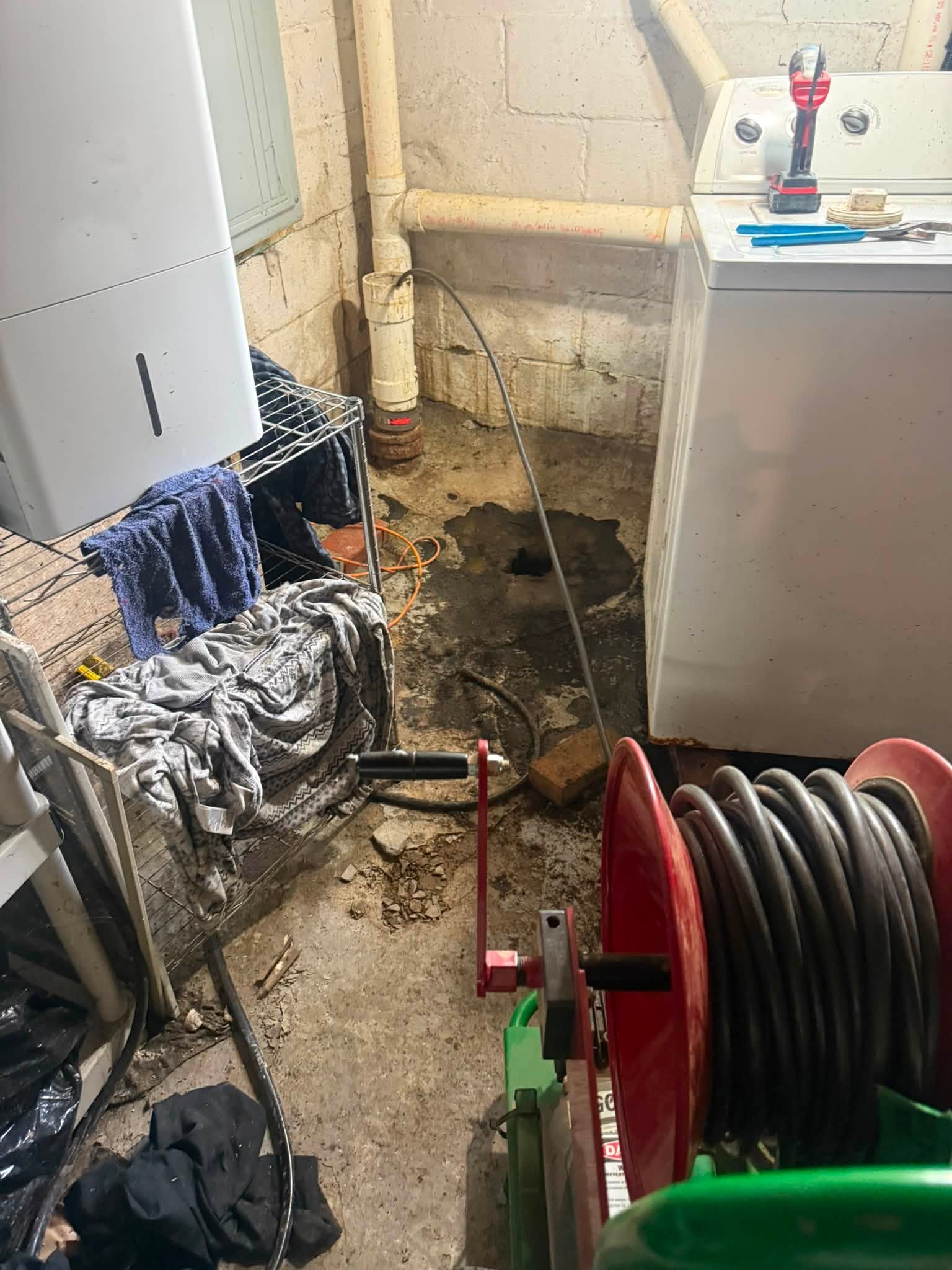 Hydro jetting hose reel staged for a drain cleaning job
