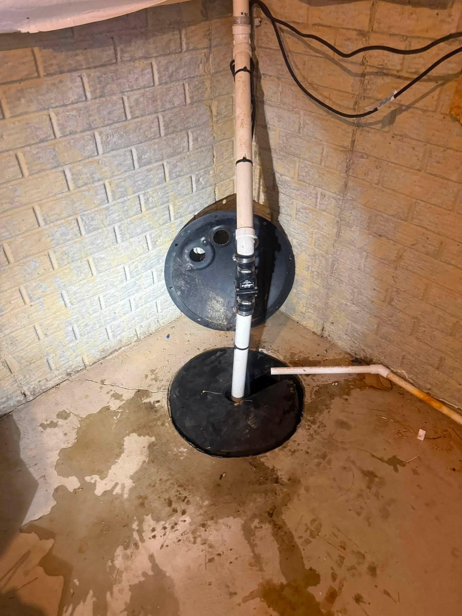 Sump pump and basin installed in a home basement